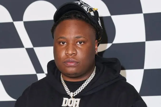 Portrait of Tay Keith in a black hoodie and cap